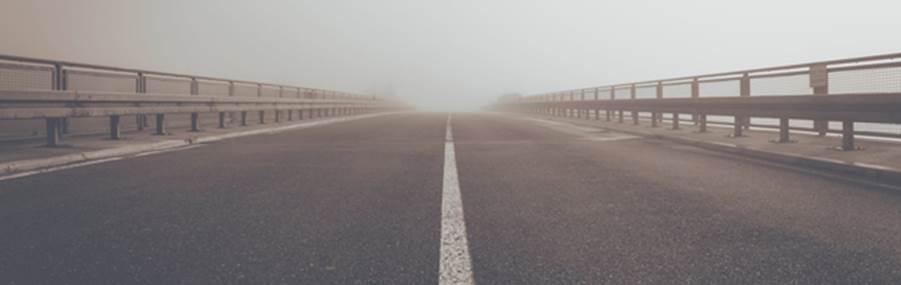 A road with a white line on it

Description automatically generated